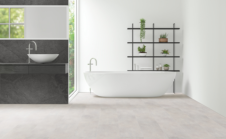 bathroom with white tub and black sink